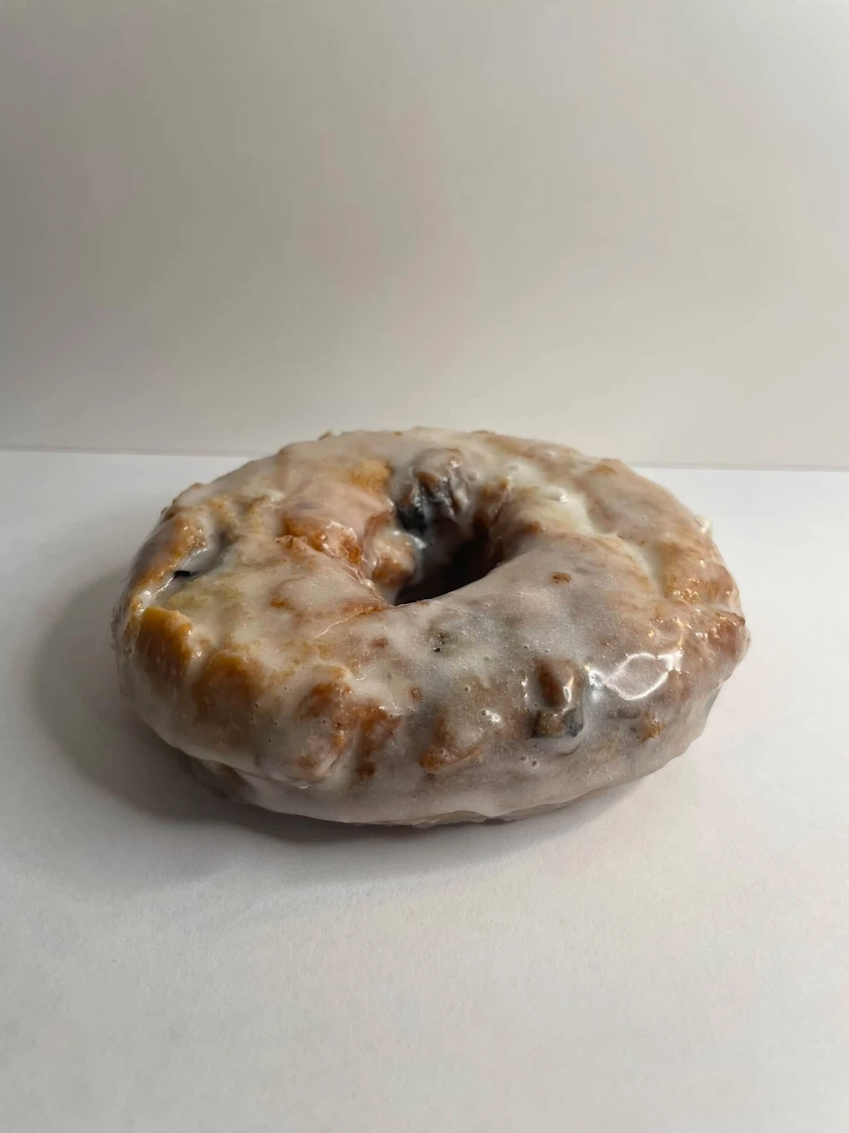 Glazed blueberry cake donut